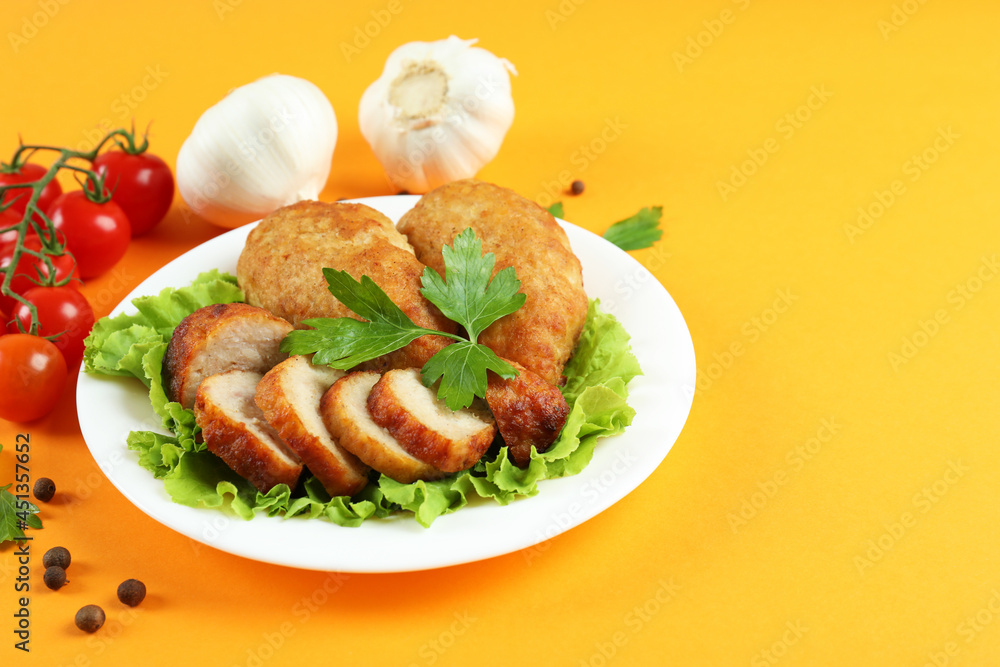 Concept of tasty food with cutlets on orange background Concept of tasty food with cutlets on orange background