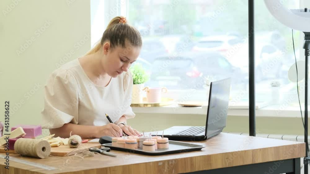 Small business owner. Portrait of mature woman standing at her shop behind the laptop and smiling. female online store seller entrepreneur packing package post shipping box preparing delivery parcel. Small business owner. Portrait of mature woman standing at her shop behind the laptop and smiling. female online store seller entrepreneur packing package post shipping box preparing delivery parcel.
