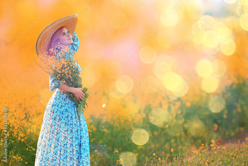 summer girl in a sunny field with flowers, warm happy sunset in nature summer girl in a sunny field with flowers, warm happy sunset in nature