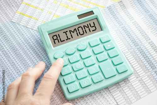A calculator with the word Alimony on the display photo