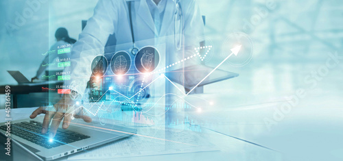 Healthcare business graph data and growth, Medical examination and doctor analyzing medical report on network connection on virtual screen. Healthcare investment and financial.