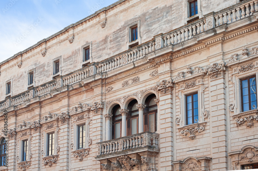 exquisite baroque work leccese exterior of the facades of the palazzo del seminario, emphasis on the rich framing of columns and balusters of the balcony of the museum