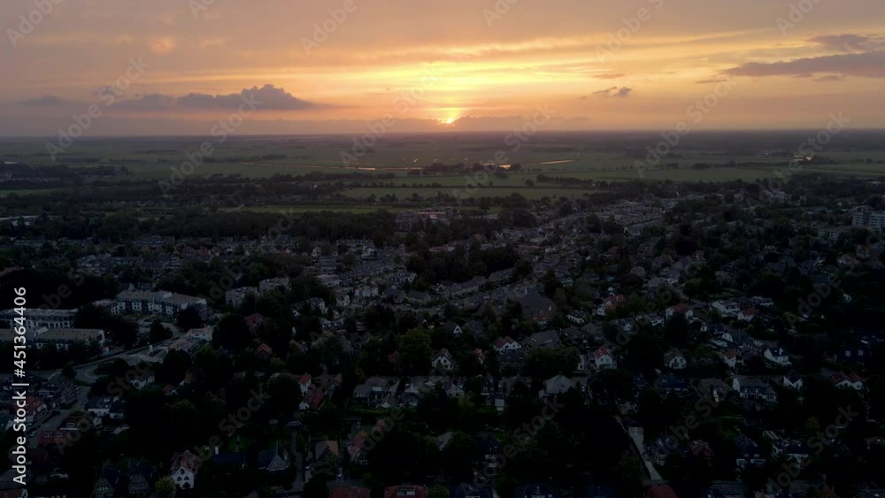 Aerial overview of a small, suburban town at sunrise Aerial overview of a small, suburban town at sunrise