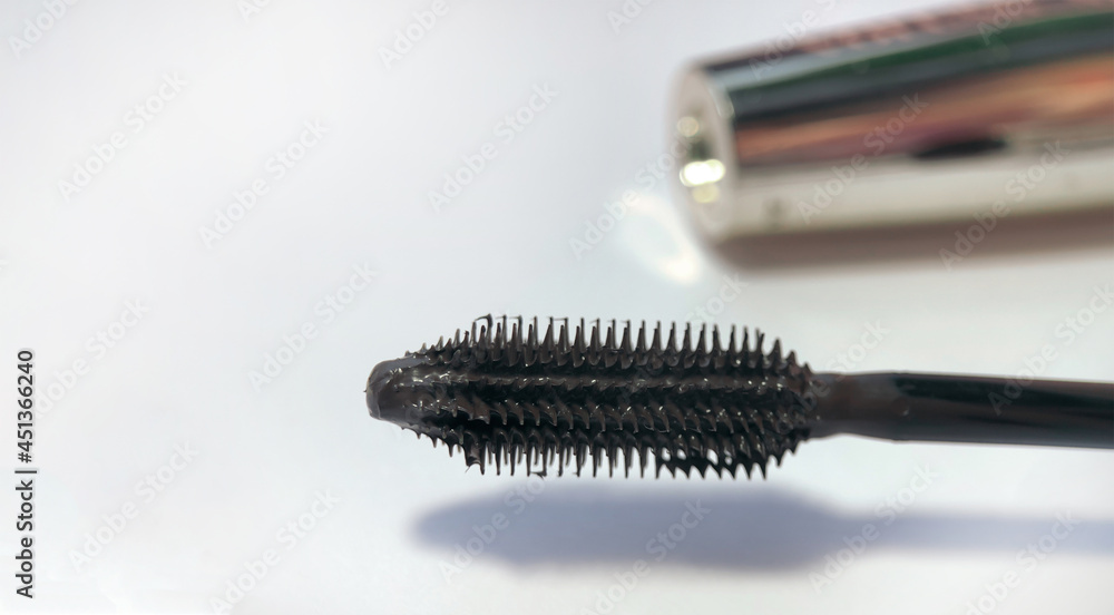 Close-up of mascara brush on white background. Beauty concept Close-up of mascara brush on white background. Beauty concept