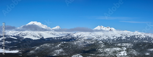 Winter panorama of the snowy Three Sisters mountains in central Oregon. © thecolorpixels