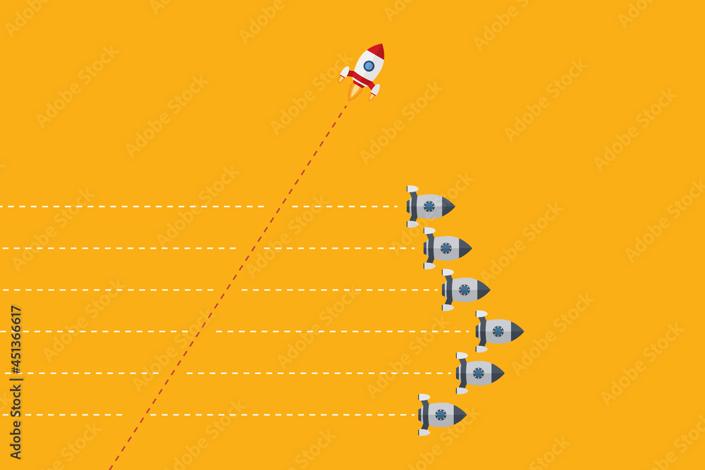 Fototapeta premium Think differently concept. Red rocket changing direction. New idea, change, trend, courage, creative solution, innovation and unique way concept.
