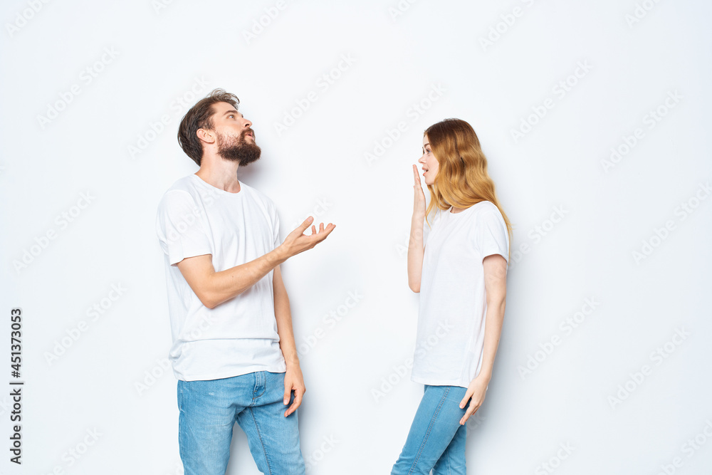 man and woman in white t-shirts jeans fashion casual style man and woman in white t-shirts jeans fashion casual style