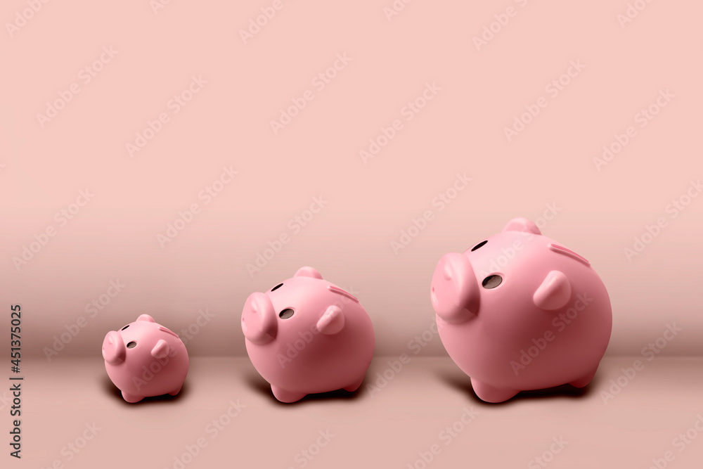 Pink piggy bank increasing in size - Growing investment concept.