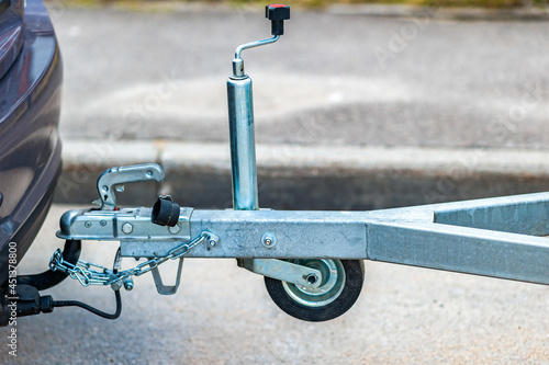 Trailer coupling device for towing a trailer by a passenger car. Cargo transportation and delivery business. Sale, rental and maintenance of trailers. Trailer driving safety concept.