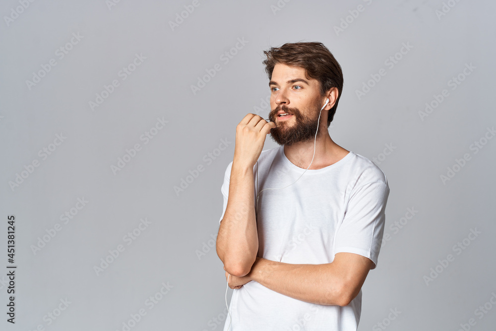 man in white t-shirt attractive look fashion casual wear light background man in white t-shirt attractive look fashion casual wear light background