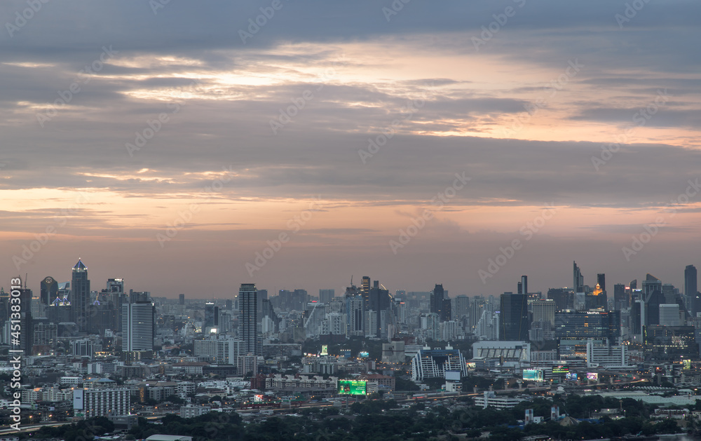 Bangkok, Thailand - Aug 04, 2021: Aerial view of Beautiful scenery view of Skyscraper Evening time Sunset creates relaxing feeling for the rest of the day. Selective focus.