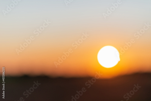 Blurred sunset landscape.Summer holiday concept. blurry beautiful sunlight and golden sunset background.