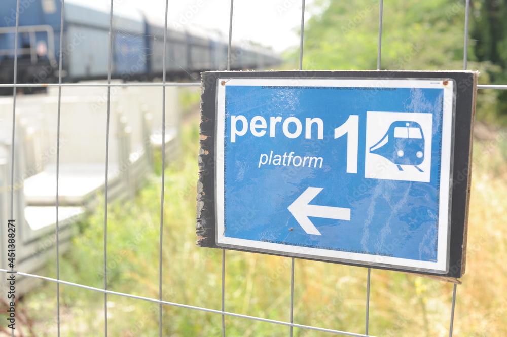 Foto de White and blue information sign on a train station in Poland ...