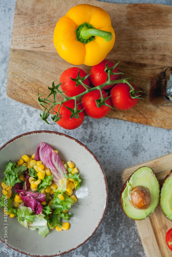 Healthy food. Avocado, cherry tomatoes, bell peppers, corn. Healthy food. Avocado, cherry tomatoes, bell peppers, corn.