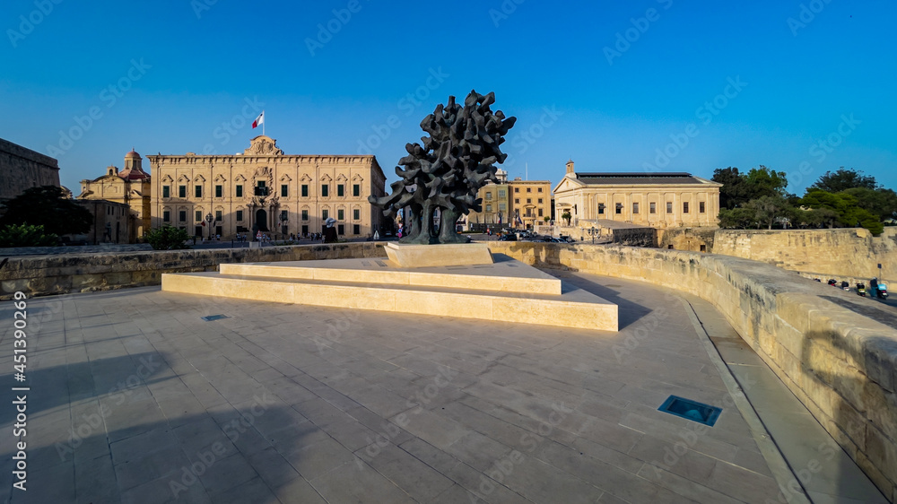 The sculpture A Flame Which Never Dies on Saint James Bastion in front of Auberge de Castille and Malta Stock Exchange.
