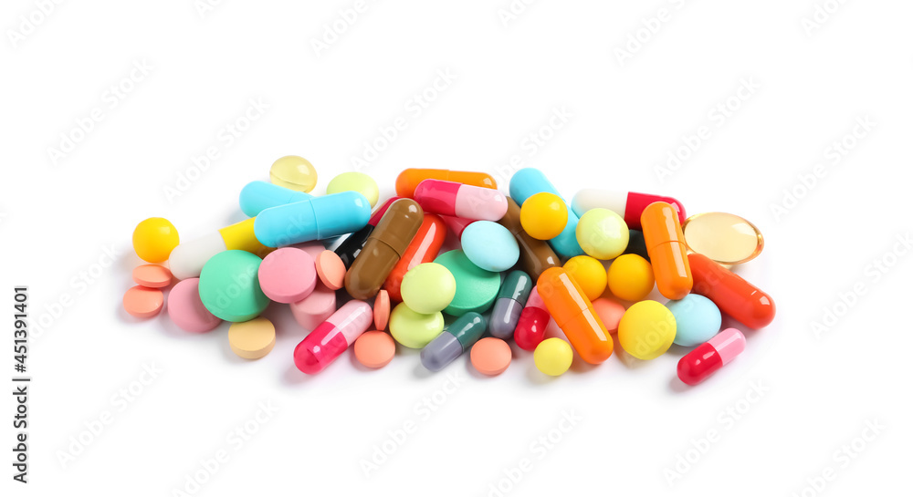 Heap of different colorful pills isolated on white Heap of different colorful pills isolated on white