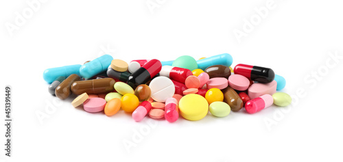Heap of different colorful pills isolated on white