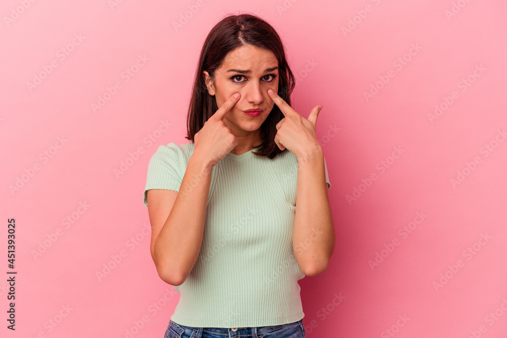 Young caucasian woman isolated on pink background crying, unhappy with something, agony and confusion concept. Young caucasian woman isolated on pink background crying, unhappy with something, agony and confusion concept.