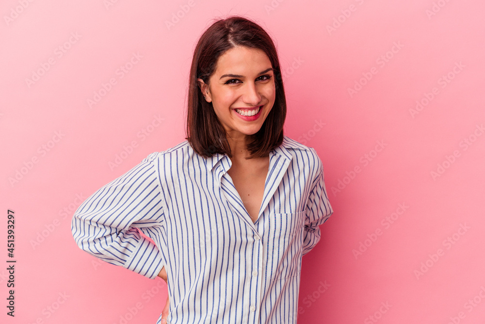 Young caucasian woman isolated on pink background happy, smiling and cheerful. Young caucasian woman isolated on pink background happy, smiling and cheerful.