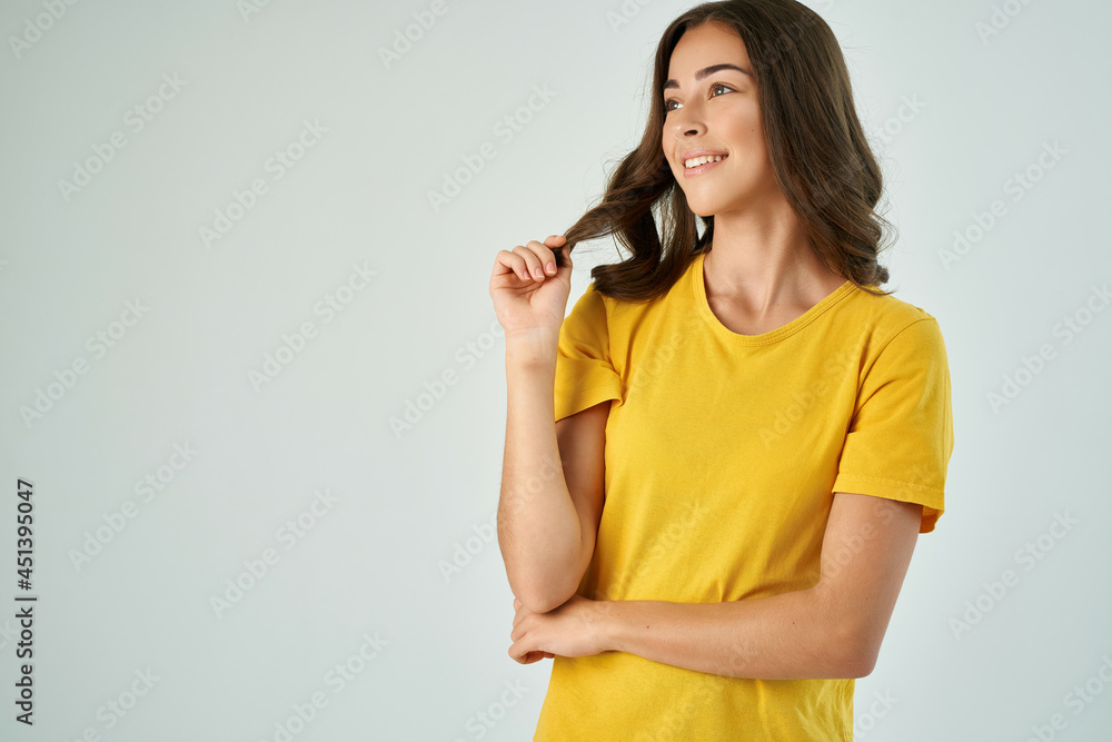 cheerful brunette in yellow t-shirt posing smile cropped view isolated background cheerful brunette in yellow t-shirt posing smile cropped view isolated background