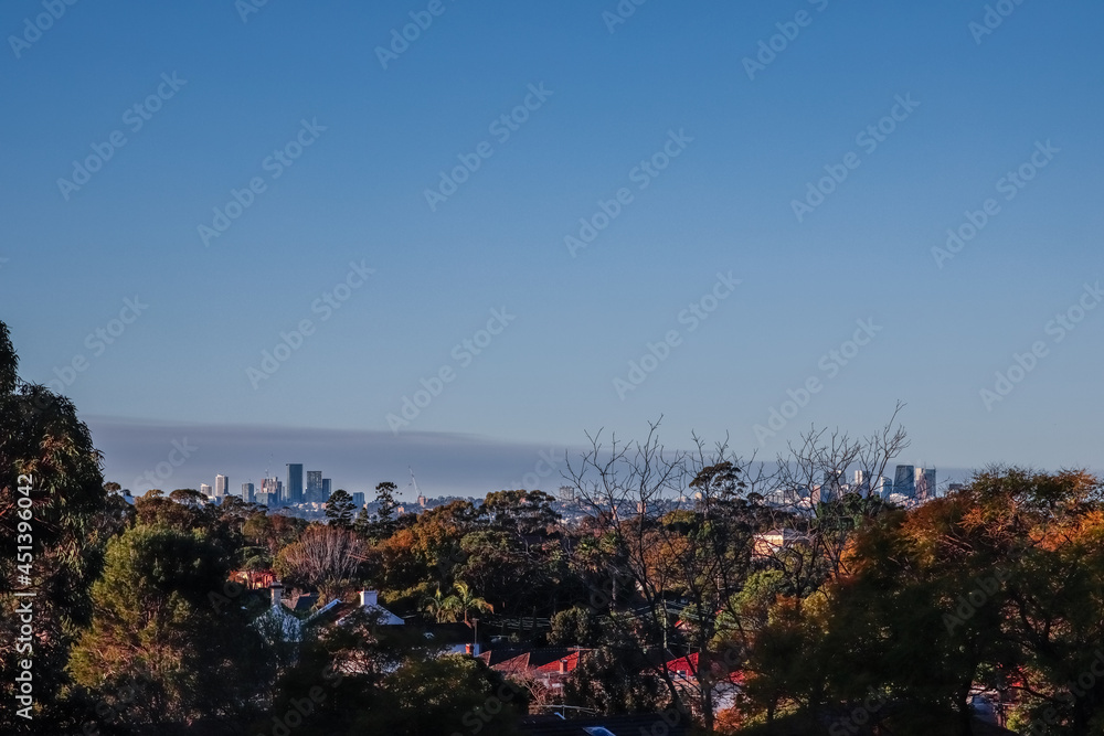 Panoramic view of Suburban Western and South Western Sydney housing, roof tops taken from a Park in Ashbury at Sunset NSW Australia