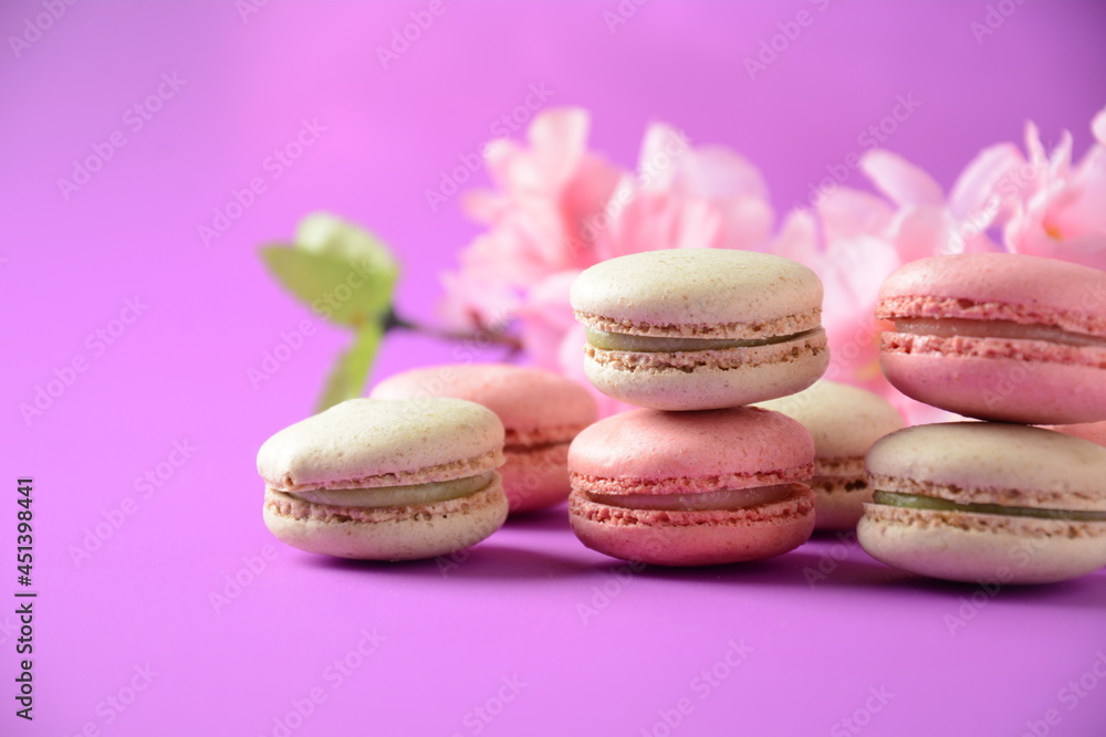 Obraz premium Colorful macarons cakes. Small French cakes. Sweet and colorful french macaroons, colorful almond cookies, pastel colors