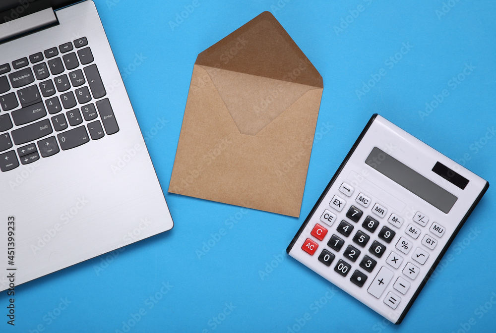 Laptop with letter, calculator on blue background. Email. Flat lay Laptop with letter, calculator on blue background. Email. Flat lay