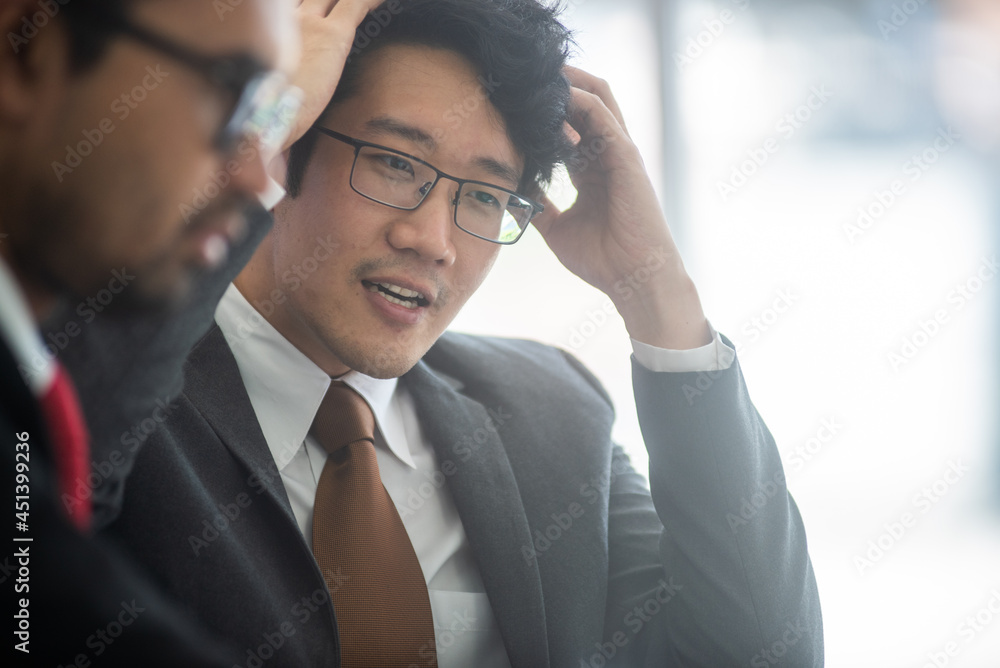 young asian professional business man brianstorming on business meeting with corporate, a male black hair wearing glasses, grey suit, businessman concept. close up face. young asian professional business man brianstorming on business meeting with corporate, a male black hair wearing glasses, grey suit, businessman concept. close up face.