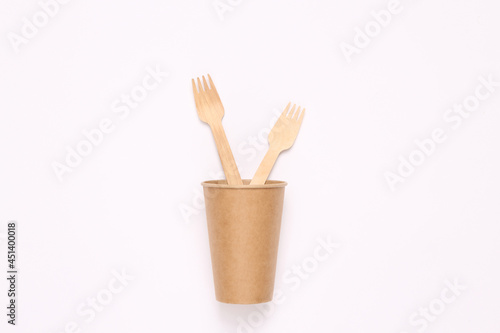 Plastic free wooden forks in cup. Zero waste, eco friendly concept. Flat lay.