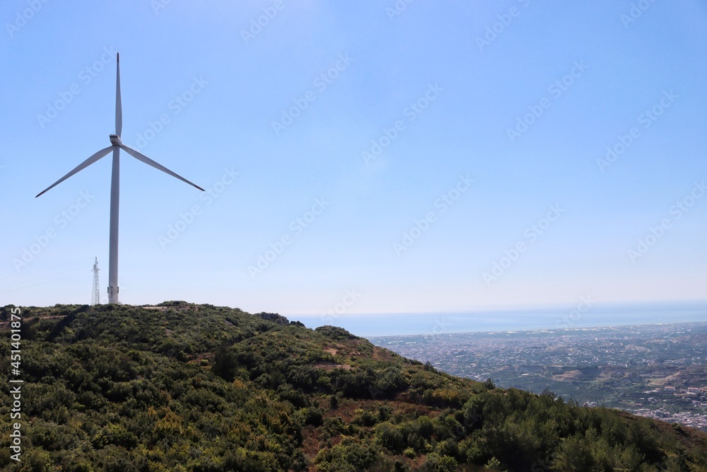 wind turbine with sea view at background