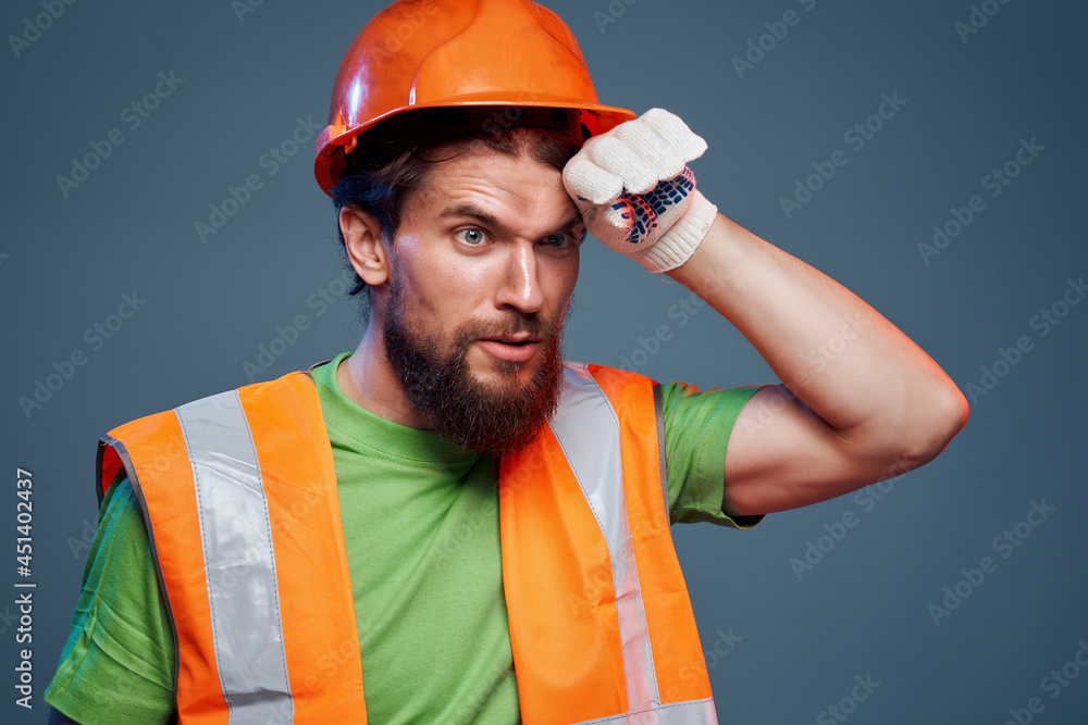 male builder orange helmet on the head industry isolated background male builder orange helmet on the head industry isolated background