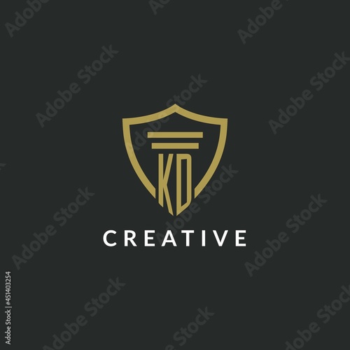 KD initial monogram logo with pillar and shield style design
