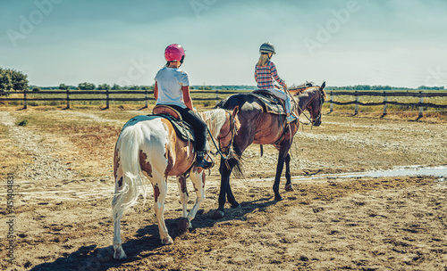 girl trains horse on a beautiful summer day.