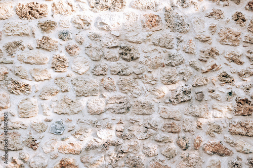 Texture of antique stone wall. Natural limestone background