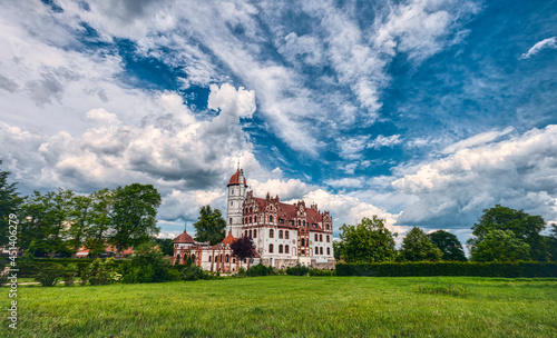 Fotografie basedow castle in mecklenburg western pomerania with a dramatic sky
