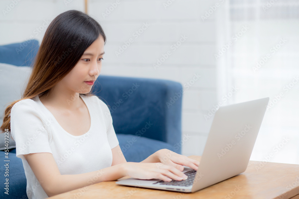 Beautiful young asian woman typing keyboard on laptop computer on desk at home, business woman working to internet online, freelance girl using notebook on table, communication and lifestyle concept. Beautiful young asian woman typing keyboard on laptop computer on desk at home, business woman working to internet online, freelance girl using notebook on table, communication and lifestyle concept.