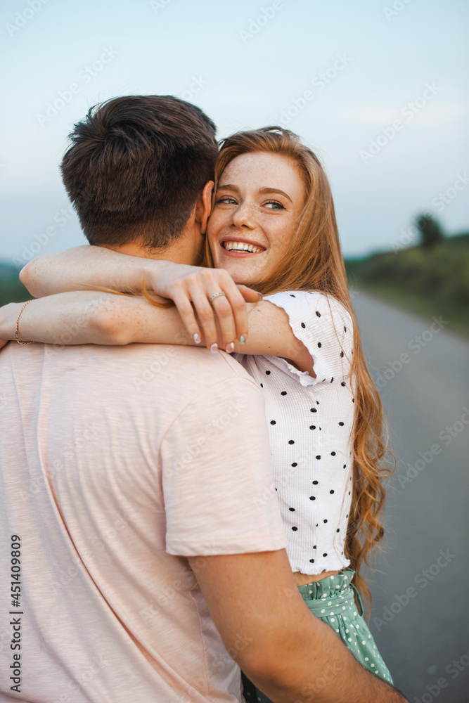 Portrait of red haired woman embracing lover. Beautiful female person. Happy family leisure. Portrait of red haired woman embracing lover. Beautiful female person. Happy family leisure.