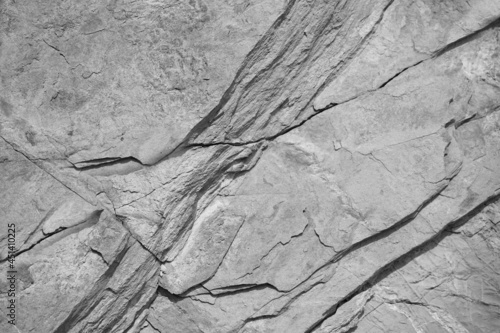 White rock texture. Close-up. Light gray stone background with copy space for design.