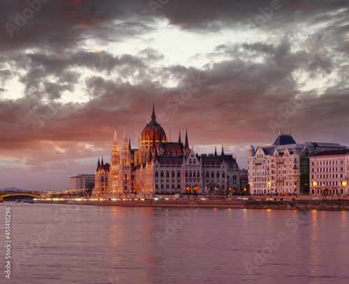 Parliament building of Budapest above Danube river in Hungary during the colorful sunset