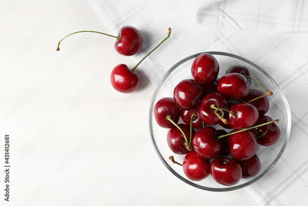 Sweet red cherries on white wooden table, flat lay. Space for text Sweet red cherries on white wooden table, flat lay. Space for text
