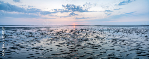 Wadden Sea panorama at sunset during low tide photo