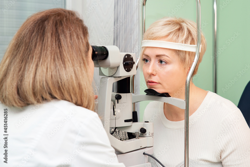 Checking the retina of a female eye close up. Patient in the ophthalmology clinic
