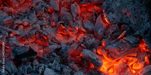 Background of the embers in a campfire or fireplace.