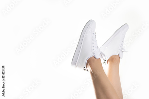 Woman in her white sneakers carefree fun photo