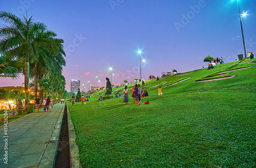 Green lawn of Inya lake park in Yangon, Myanmar photo