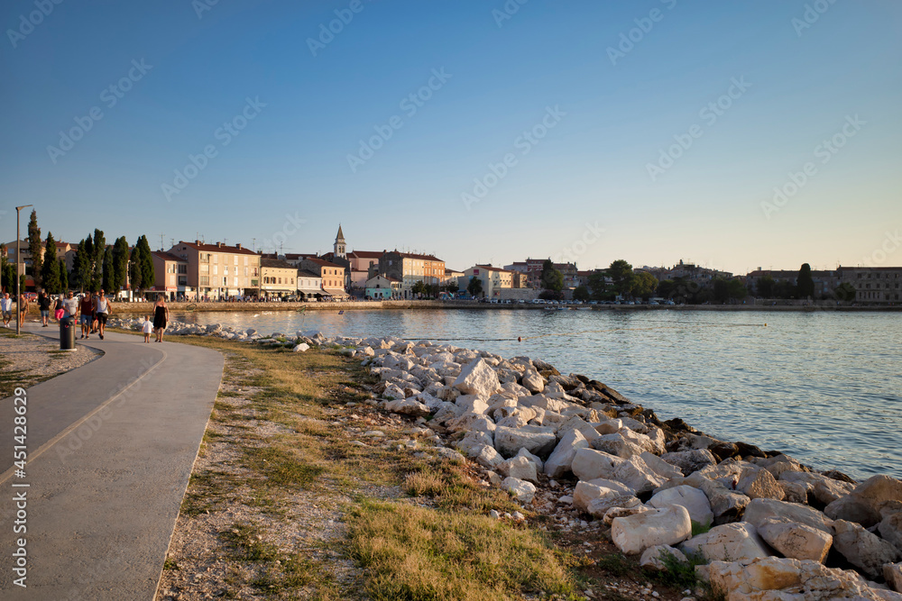 Adriatic Sea resort. city ​​beaches, vegetation and buildings. Seascape with a stone shore.