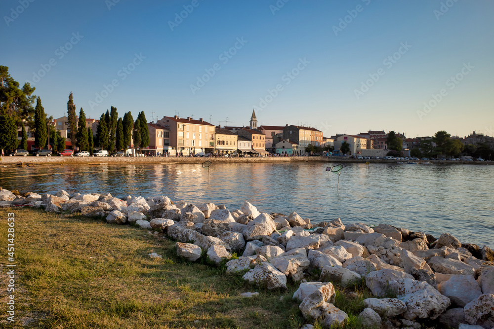 Adriatic Sea resort. city beaches, vegetation and buildings. Seascape with a stone shore.