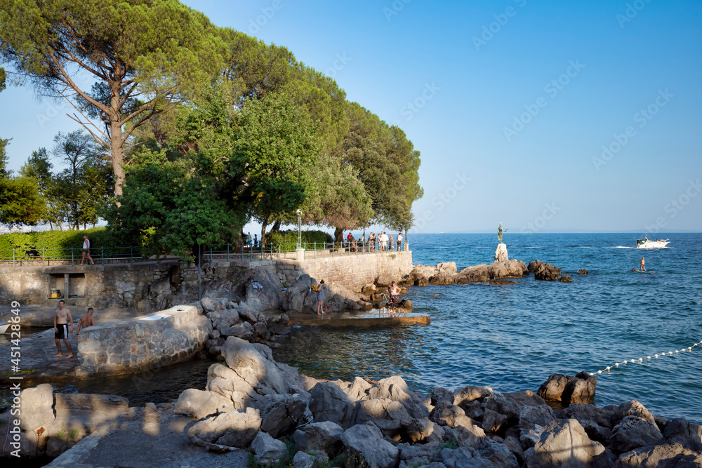 Adriatic Sea resort. city beaches, vegetation and buildings. Seascape with a stone shore.