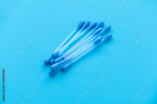 A cotton buds on blue background.