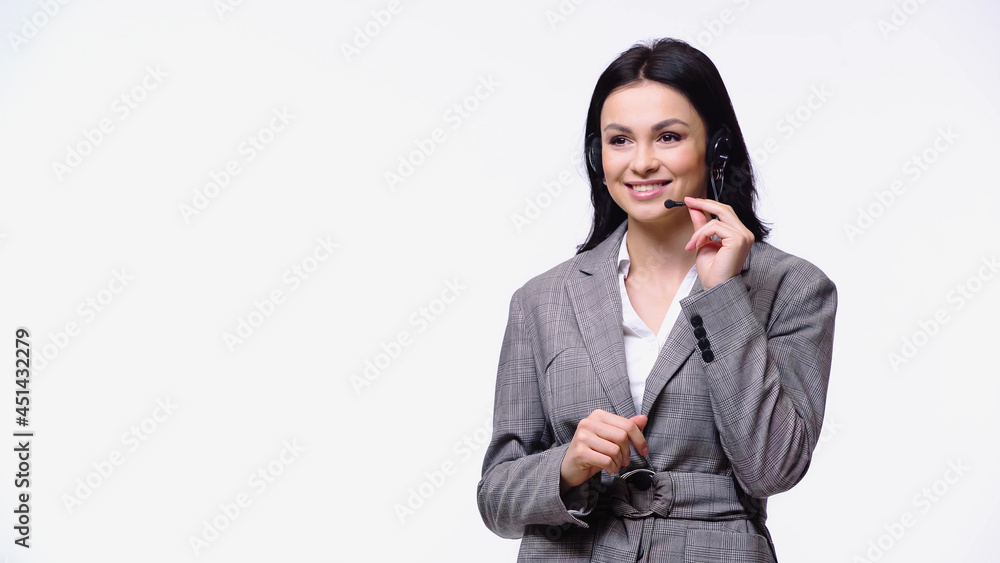 Smiling businesswoman using headset isolated on white. Smiling businesswoman using headset isolated on white.